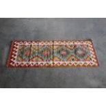 An approx 5' x 1'8" Chobi Kilim rug
