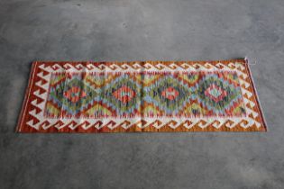 An approx 5' x 1'8" Chobi Kilim rug