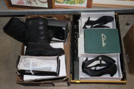 Two boxes of shoes and boots
