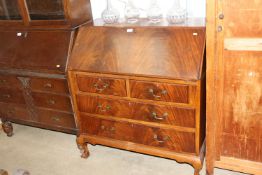 A mahogany bureau fitted two short and two long dr