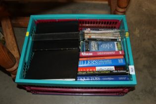 A box of miscellaneous books and DVDs