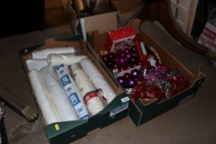 A box of disposable cups and Christmas decorations