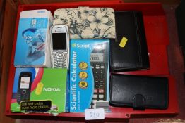 A collection of mobile phones and calculators