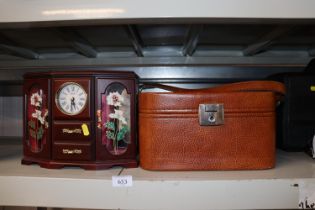 A travelling toilet case and a trinket cabinet wit