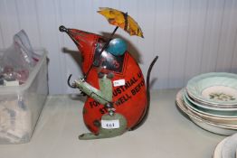 A metal ware figure of a mouse with an umbrella