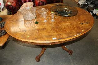 A Victorian inlaid walnut tilt top table