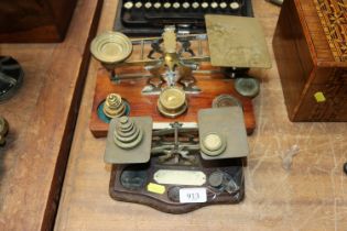 A Two sets of brass postage scales and some weights