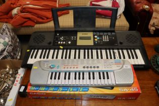 A Casio keyboard and a Yamaha keyboard