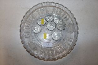 A George VI commemorative glass plate and seven commemorative crowns