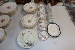 Five floral decorated coffee cans and saucers, two