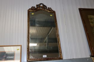 A gilt framed wall mirror