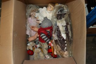 A collection of various dolls and soft toys