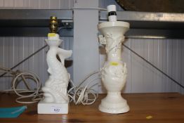 A Casa Pupo white glazed pottery table lamp in the form of a dolphin and an iron white painted