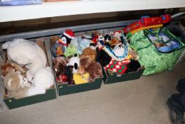A collection of various children's soft toys and b