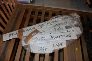 A quantity of various wedding signs