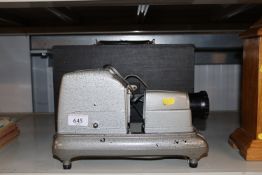 A slide projector and case