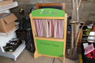 A folding A-board and a puppet theatre