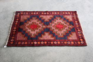 An approx 4'6" x 2'8" Baluchi rug