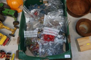 A large collection of plastic toy soldiers and other figures