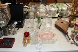 A collection of various glass vases, candle holder