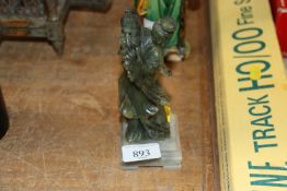 An Oriental green hardstone figure of an immortal