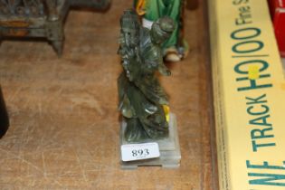 An Oriental green hardstone figure of an immortal