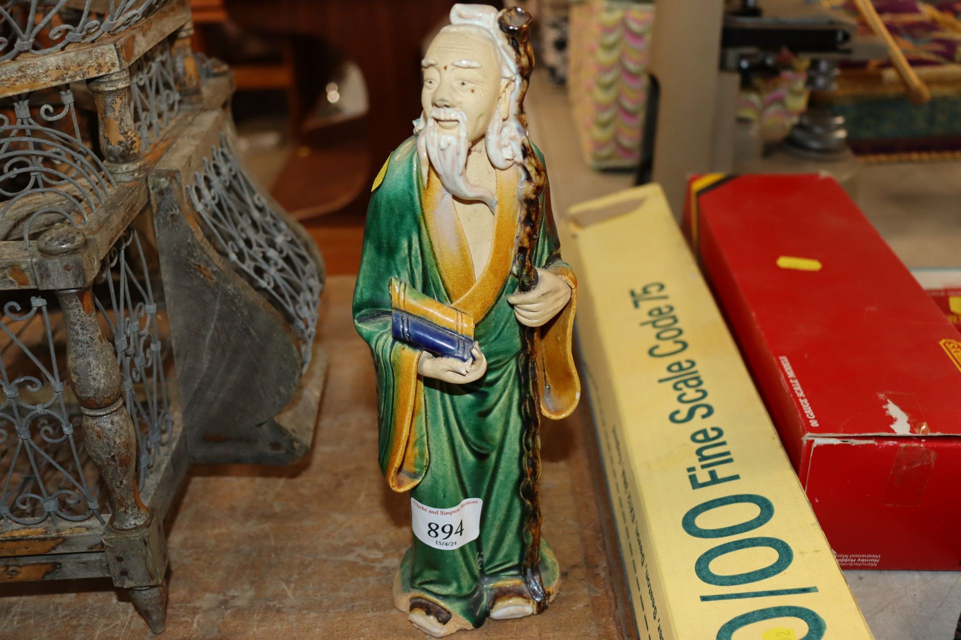 A Chinese glazed pottery figure of a Sage