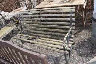 A scroll end wooden and metal garden bench AF