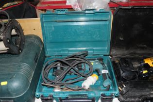 A Makita 110v electric drill in fitted case