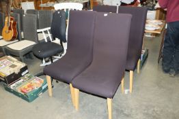A set of four modern dining chairs