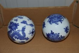 Two Oriental blue and white spheres