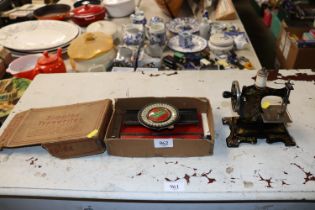 A child's Simplex typewriter and a child's toy sew