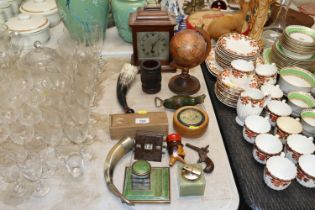 A small table globe, a mantle clock, various woode