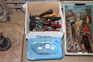 A box and a plastic crate of various tools