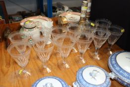 A set of twelve cut glass conical shaped wine glas