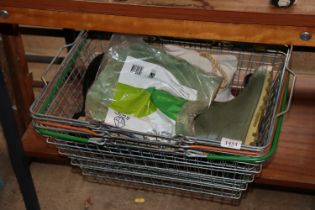 A metal basket and contents of Wellington boots