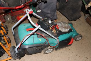 A Bosch cordless lawnmower with battery and charge