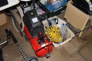 A Sealey 24 litre compressor with a box of various