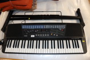 A Casio touch response keyboard and folding stand