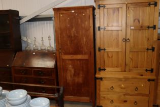 A pine and plywood storage cupboard