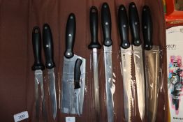 A cased nine piece knife set