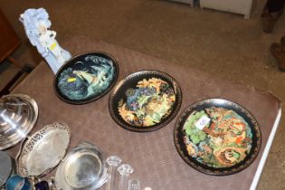 Four collector's plates and a porcelain figural sp