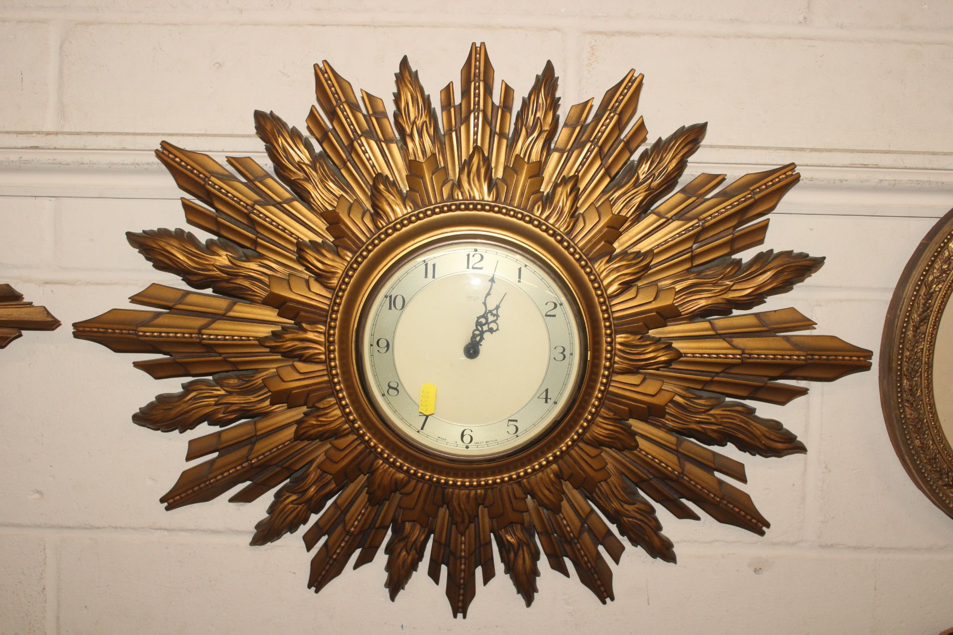 A gilt Smiths Sunburst wall clock