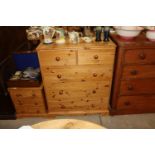 A pine chest of two short and three long drawers