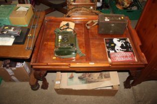 A mahogany tray top coffee table raised on ball an