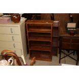 Two teak open fronted bookcases