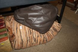 A rag rug and a leather pouffe