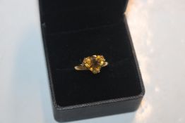 A 14ct gold trillion cut topaz ring, ring size L/M