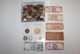 A box of various coins and bank notes