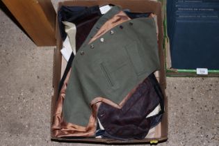 A box containing vintage waistcoats etc.